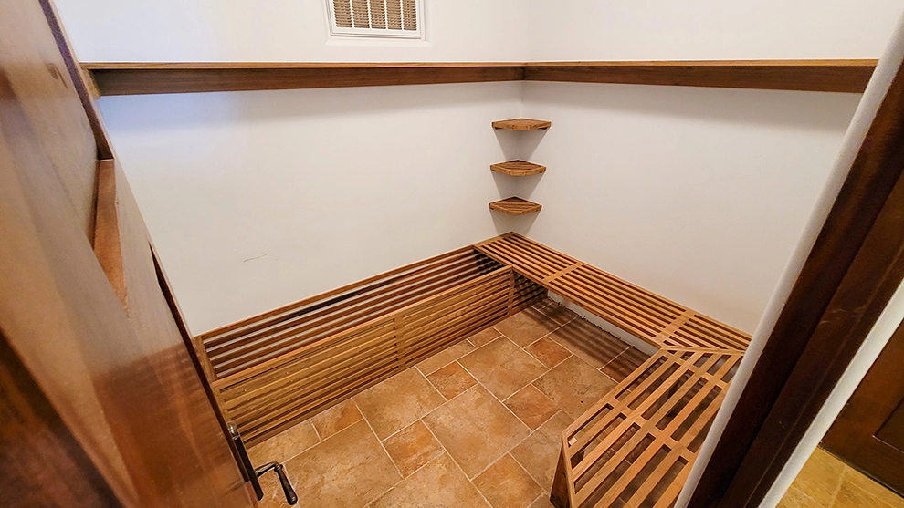 Custom garage cabinets with a butcher block top, designed and installed by Haggerty Construction.